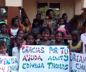 Kids at the Dream Again Home With Banners